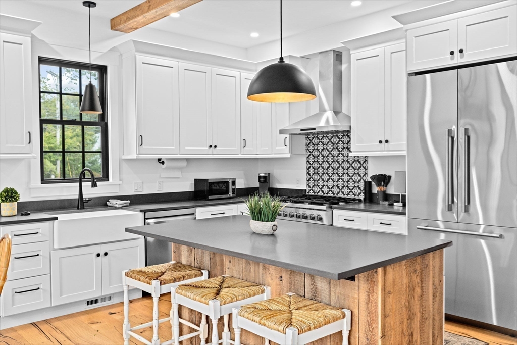 42 Captain Peirce Road Scituate, MA 02066 - Photo 4 of 40 a kitchen with stainless steel appliances a sink a stove a refrigerator and cabinets