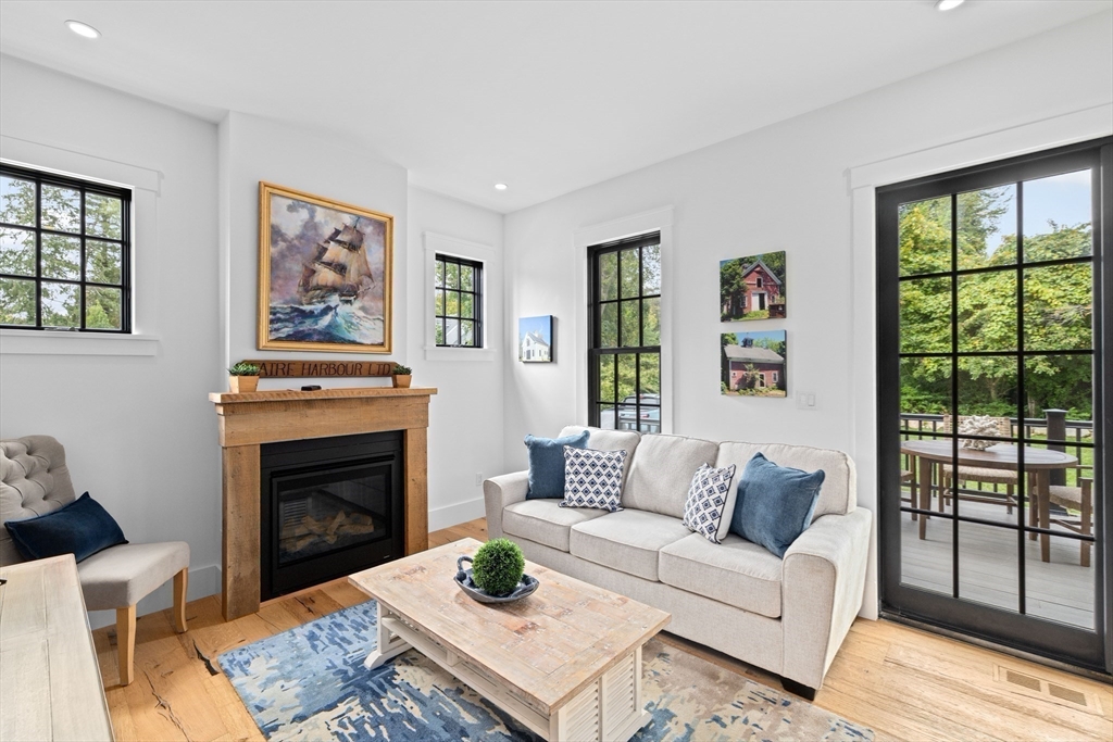 42 Captain Peirce Road Scituate, MA 02066 - Photo 5 of 40 a living room with furniture and a fireplace
