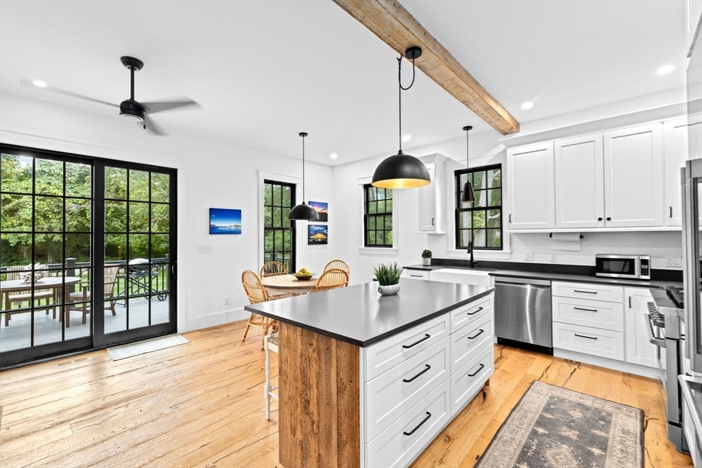42 Captain Peirce Road Scituate, MA 02066 - Photo 10 of 40 a kitchen with stainless steel appliances granite countertop a stove and a wooden floors