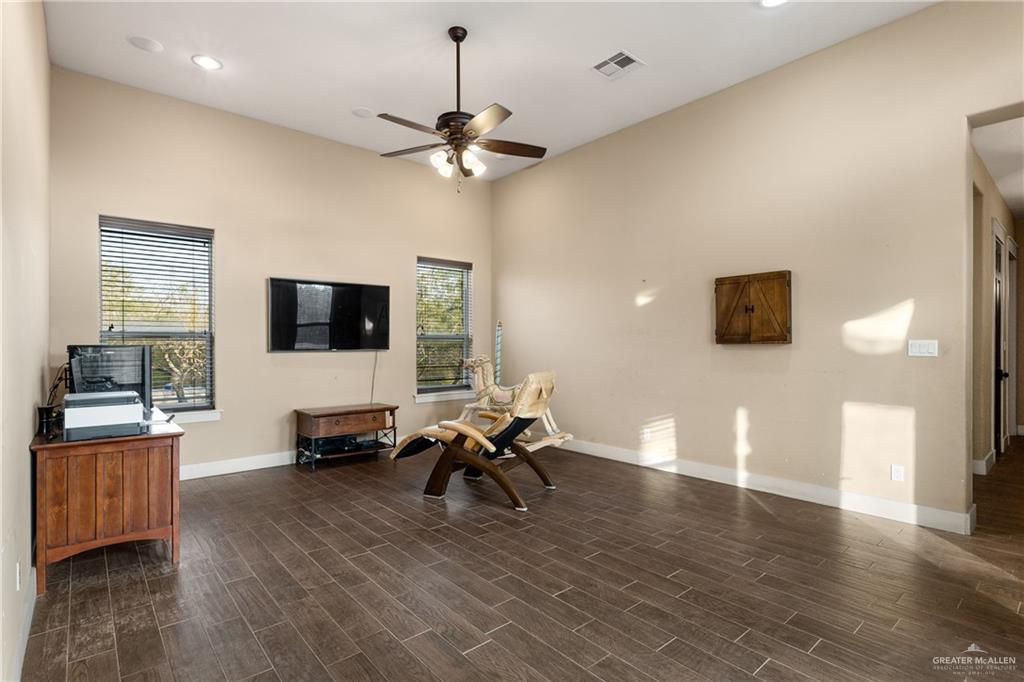17839 Abd Road Harlingen, TX 78552 - Photo 12 of 38 a living room with furniture and a flat screen tv