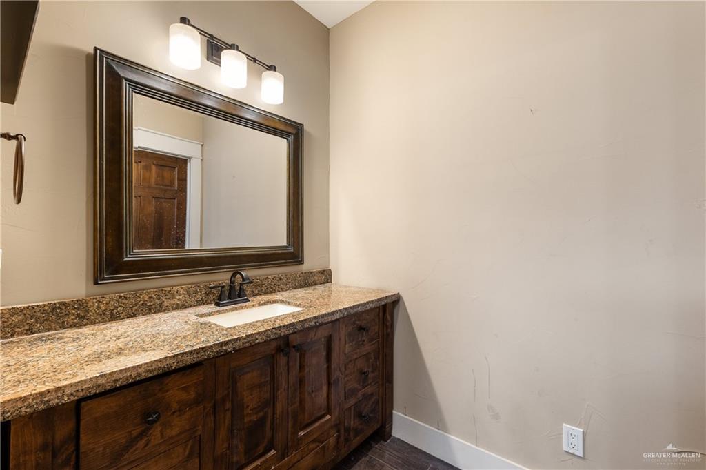 17839 Abd Road Harlingen, TX 78552 - Photo 24 of 38 a bathroom with a sink and a mirror