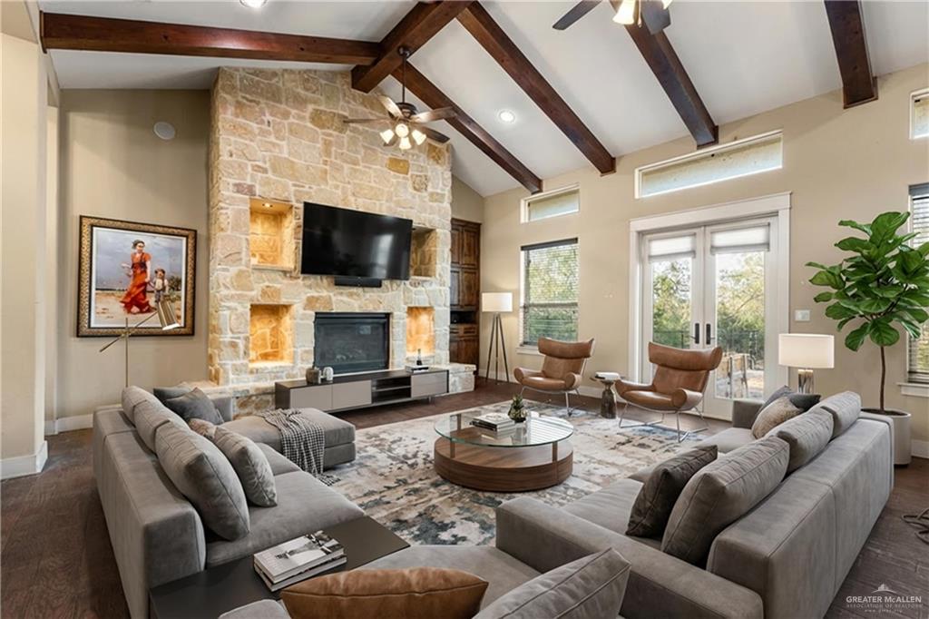 17839 Abd Road Harlingen, TX 78552 - Photo 4 of 38 a living room with furniture fireplace and a flat screen tv