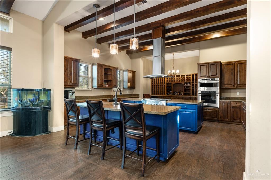 17839 Abd Road Harlingen, TX 78552 - Photo 5 of 38 a kitchen with a dining table and chairs