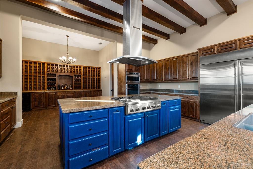 17839 Abd Road Harlingen, TX 78552 - Photo 6 of 38 a kitchen with stainless steel appliances granite countertop a stove a sink and a refrigerator
