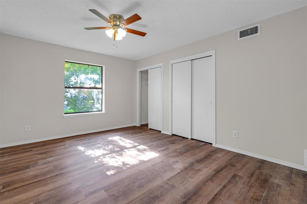 209 Mistletoe Lane Keene, TX 76059 - Photo 29 of 38 wooden floor in an empty room with a window