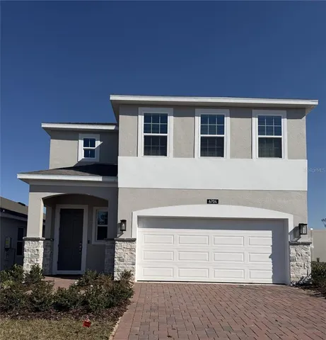 a view of house with yard