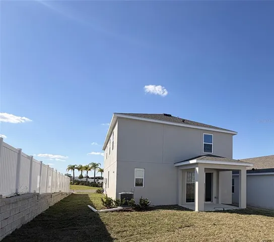 a sign in the middle of a garden