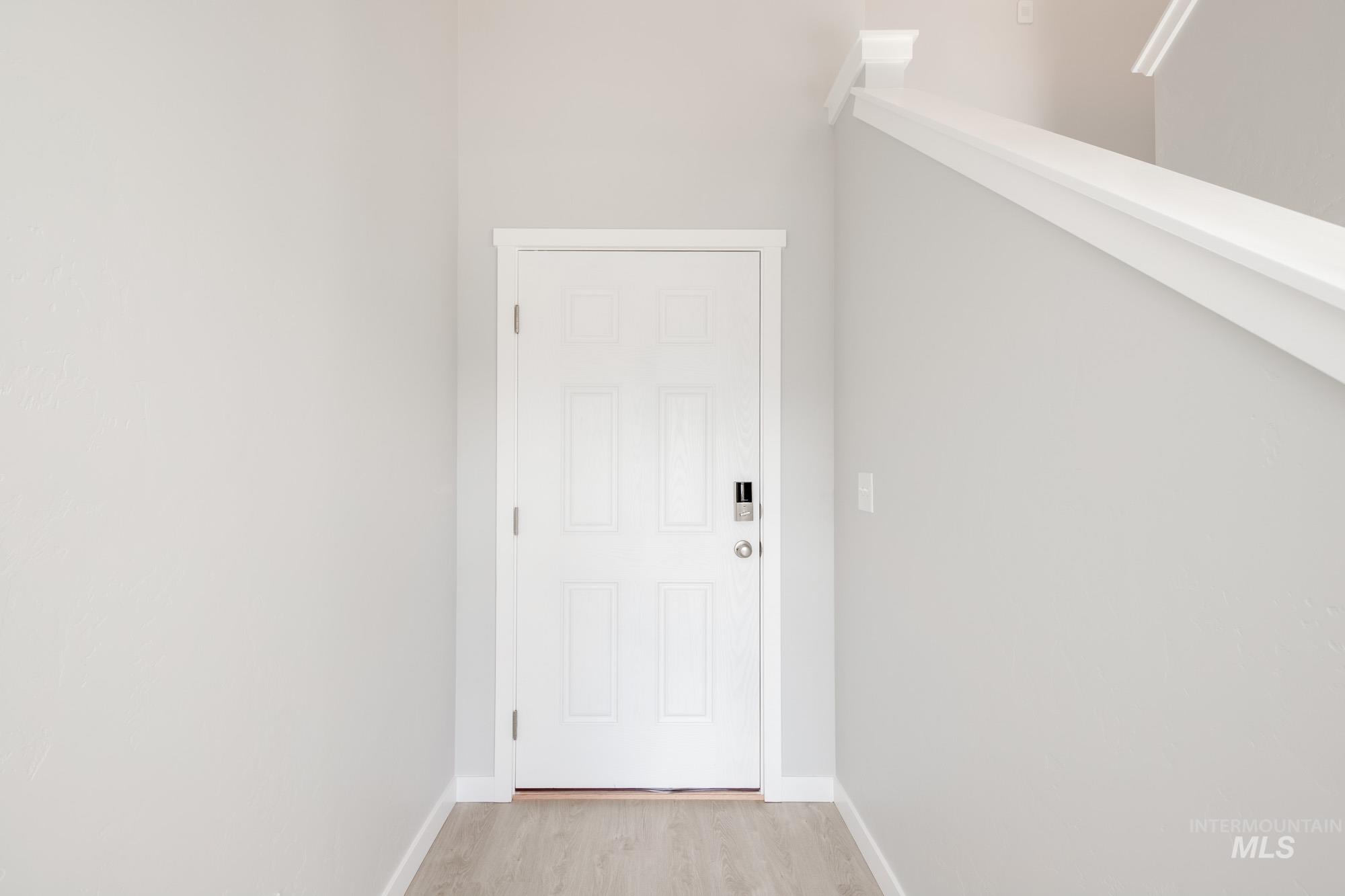 229 Moose Street Horseshoe Bend, ID 83629 - Photo 2 of 27 Doorway to outside featuring baseboards and wood finished floors