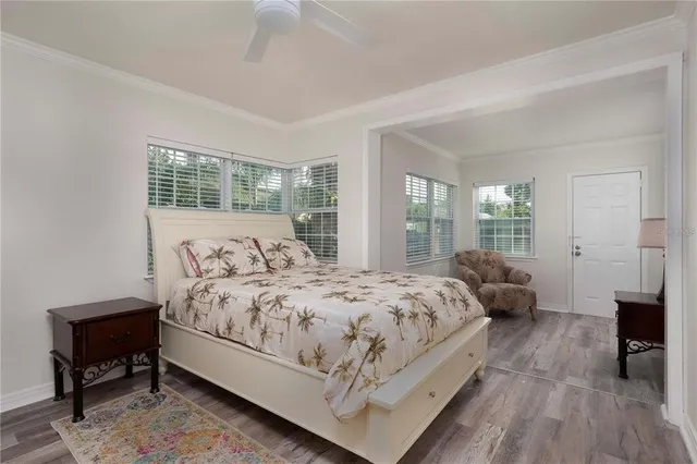 a bedroom with bed and a window