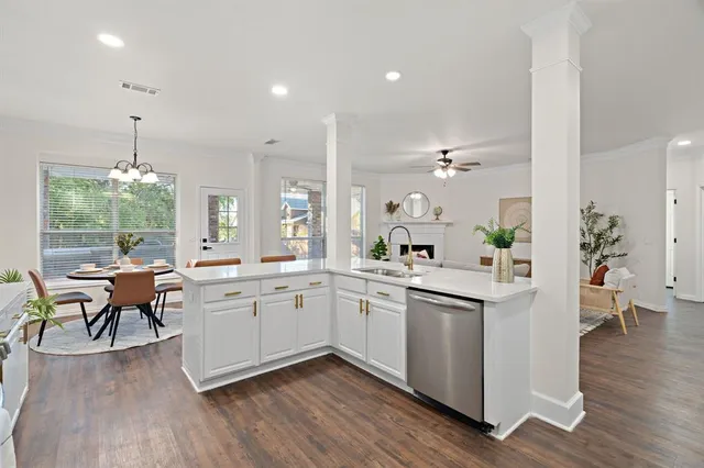 a large kitchen with kitchen island a sink and a stove