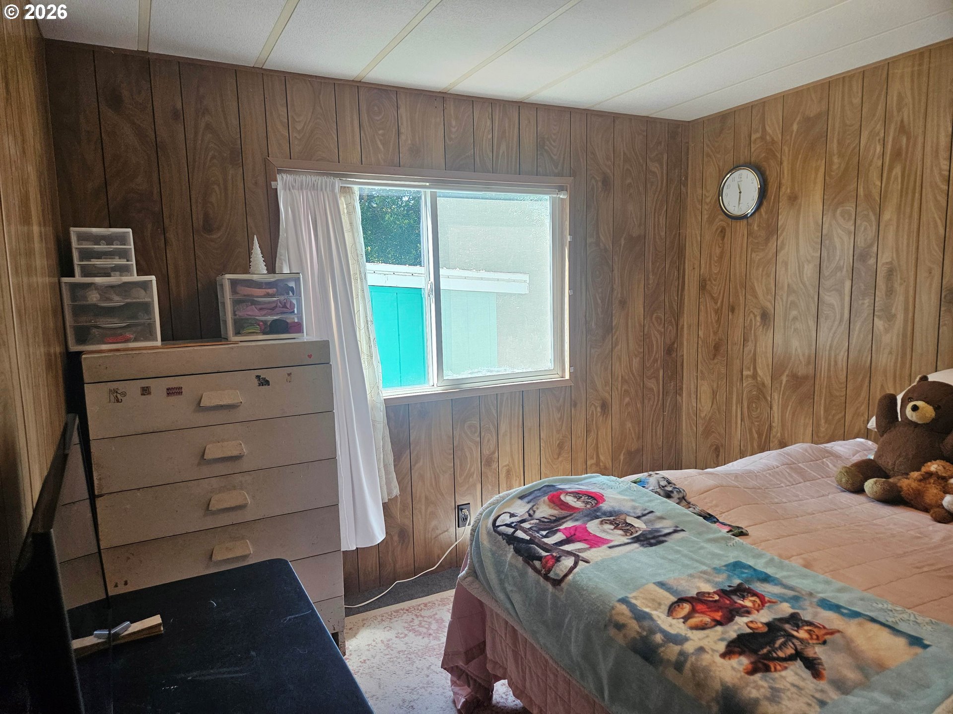 1600 Rhododendron Drive, Unit 214 Florence, OR 97439 - Photo 17 of 38 a bedroom with a bed and a dresser