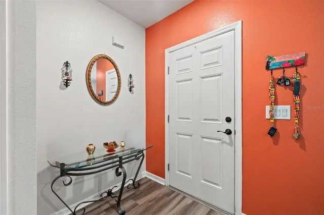 a view of a livingroom with furniture and a bathroom
