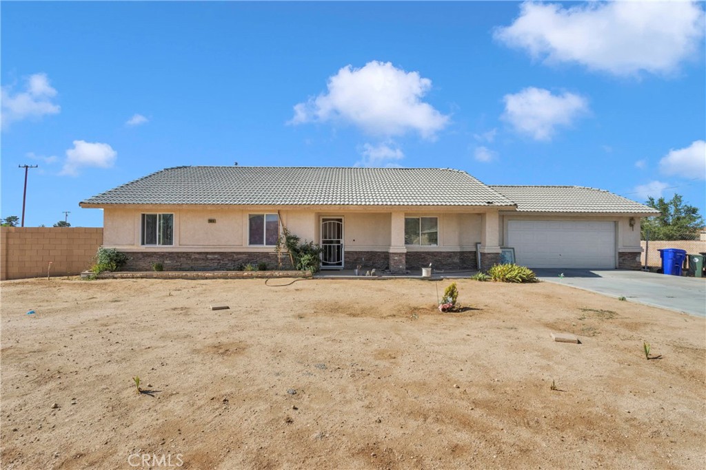 20918 Sioux Road Apple Valley, CA 92308 - Photo 1 of 1 a house view with a sitting space