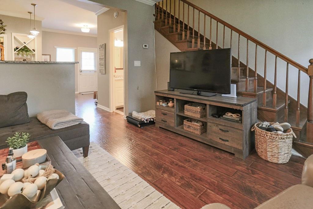 1307 Kinney Avenue, Unit 121 Austin, TX 78704 - Photo 6 of 12 a living room with furniture and a flat screen tv