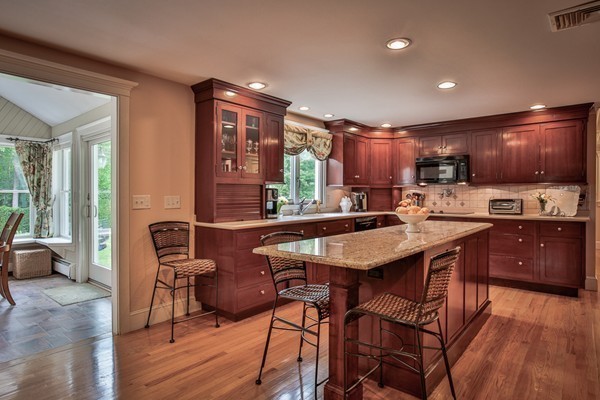 84 Sunset Rock Road Andover, MA 01810 - Photo 11 of 30 a kitchen with a sink a counter space and stainless steel appliances