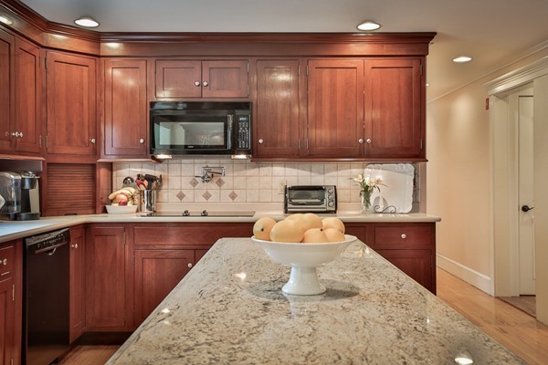 84 Sunset Rock Road Andover, MA 01810 - Photo 12 of 30 a kitchen with stainless steel appliances wooden cabinets and a sink