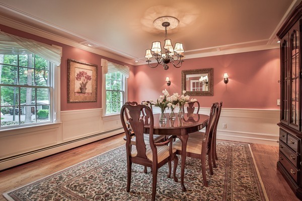 84 Sunset Rock Road Andover, MA 01810 - Photo 16 of 30 a view of a dining room with furniture a chandelier and wooden floor