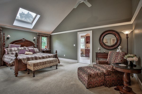84 Sunset Rock Road Andover, MA 01810 - Photo 20 of 30 a living room with furniture a mirror and a clock