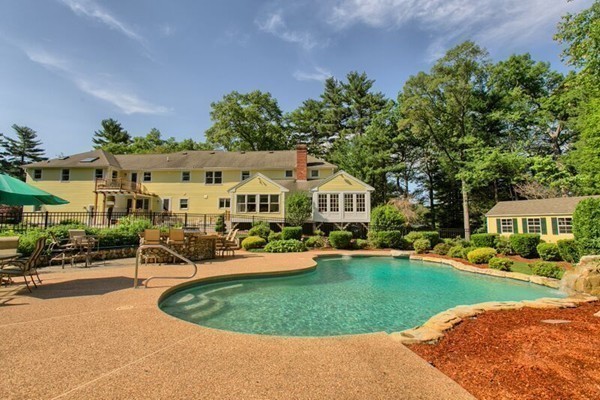 84 Sunset Rock Road Andover, MA 01810 - Photo 2 of 30 a view of a house with a swimming pool and sitting area