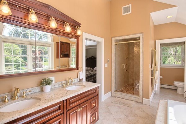 84 Sunset Rock Road Andover, MA 01810 - Photo 22 of 30 a bathroom with a granite countertop sink and a mirror