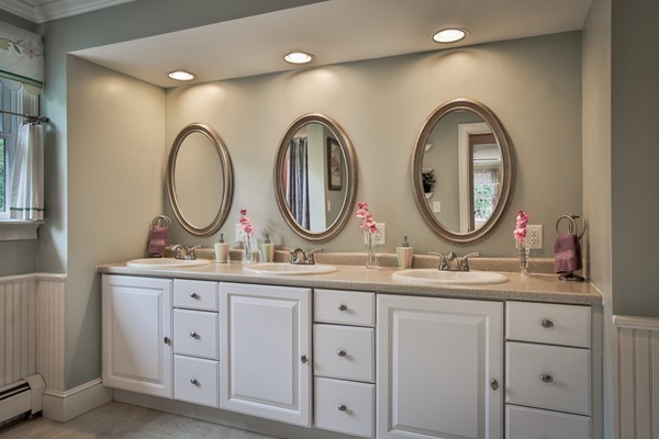 84 Sunset Rock Road Andover, MA 01810 - Photo 24 of 30 a bathroom with double vanity and a mirror