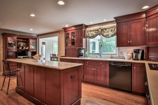 84 Sunset Rock Road Andover, MA 01810 - Photo 5 of 30 a kitchen with stainless steel appliances granite countertop wooden cabinets a sink and dishwasher with wooden floor