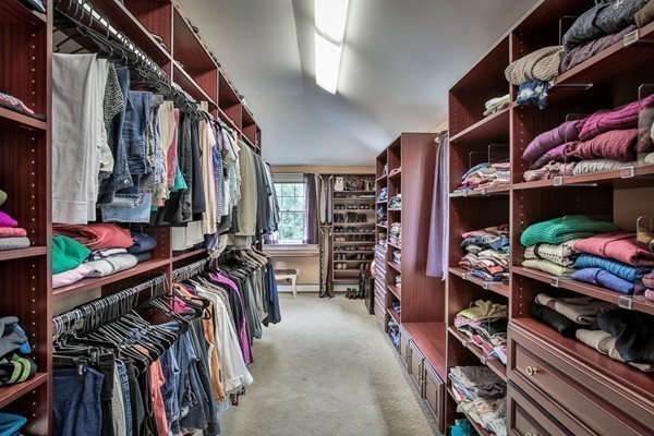 84 Sunset Rock Road Andover, MA 01810 - Photo 7 of 30 a view of walk in closet with clothes and shoes