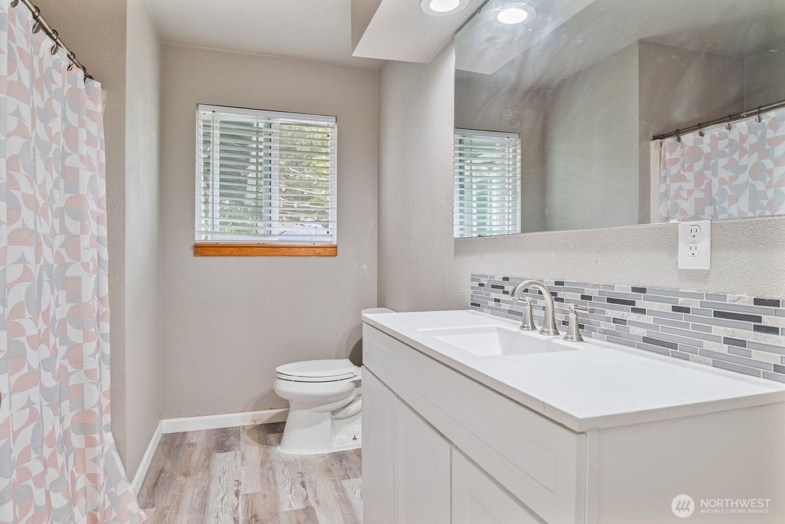 2244 Lee Avenue Longview, WA 98632 - Photo 20 of 27 a bathroom with a sink toilet vanity and a window