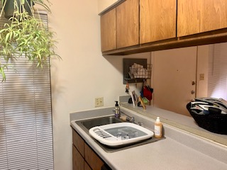 105 East 31st Street, Unit 101 Austin, TX 78705 - Photo 5 of 9 Laundry area featuring a sink