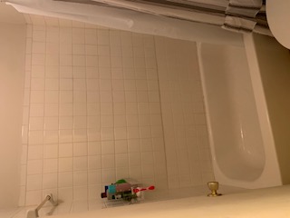 105 East 31st Street, Unit 101 Austin, TX 78705 - Photo 7 of 9 Bathroom featuring shower / tub combo and toilet