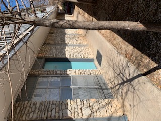 105 East 31st Street, Unit 101 Austin, TX 78705 - Photo 8 of 9 View of property exterior with stone siding