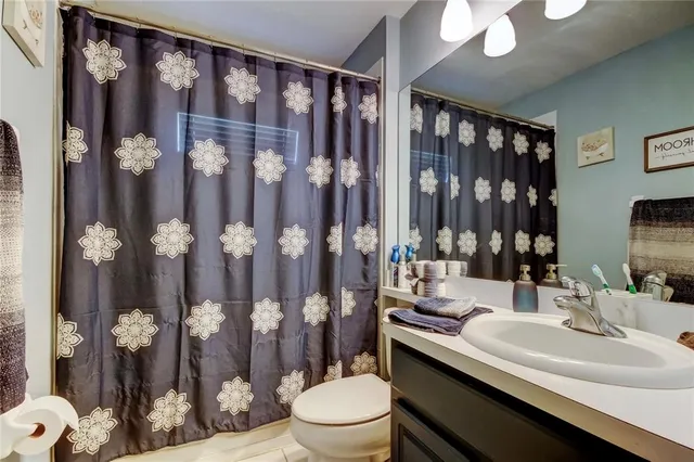 a bedroom with a bed and dresser