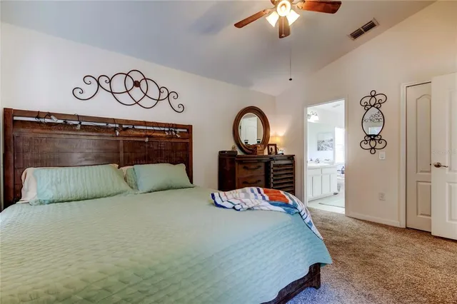 a bedroom with a bed and a baby bed