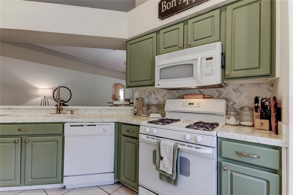 4522 Lisette Circle Brooksville, FL 34604 - Photo 38 of 59 a kitchen with cabinets appliances and a sink