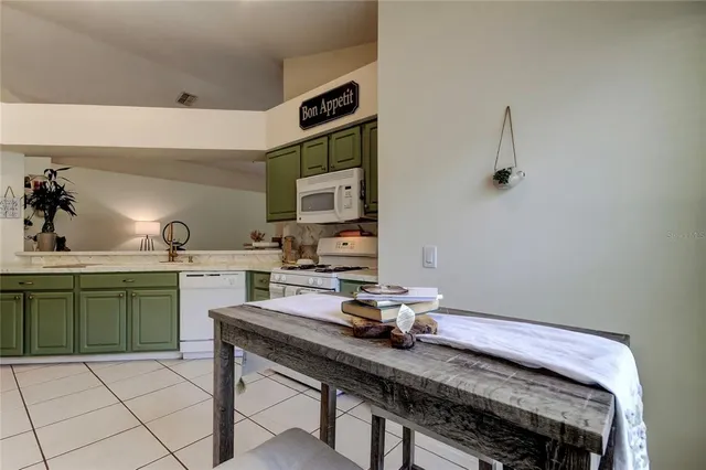 a view of backyard with seating area and trees
