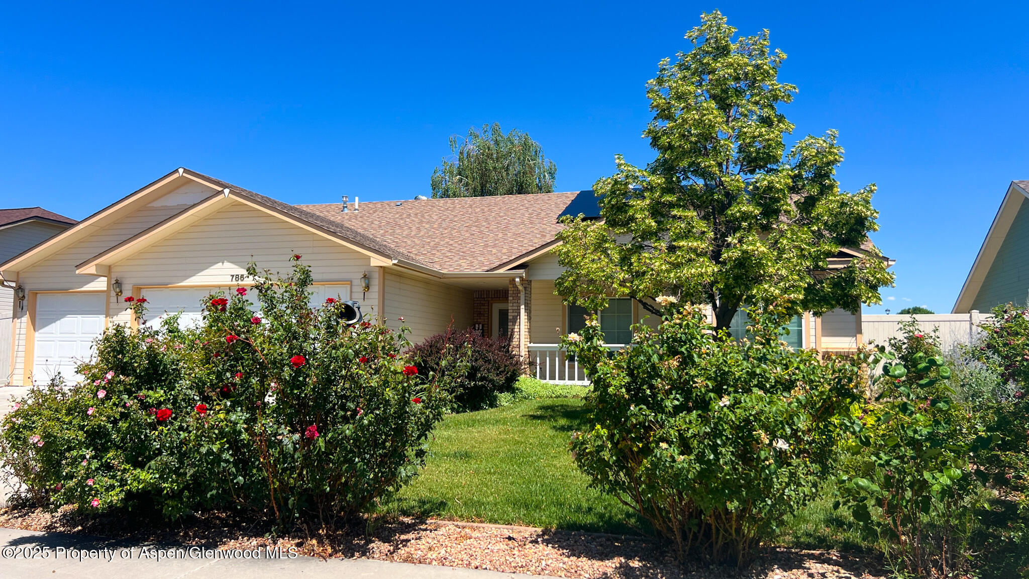 786 Comstock Drive Fruita, CO 81521 - Photo 1 of 38 a front view of a house with a yard
