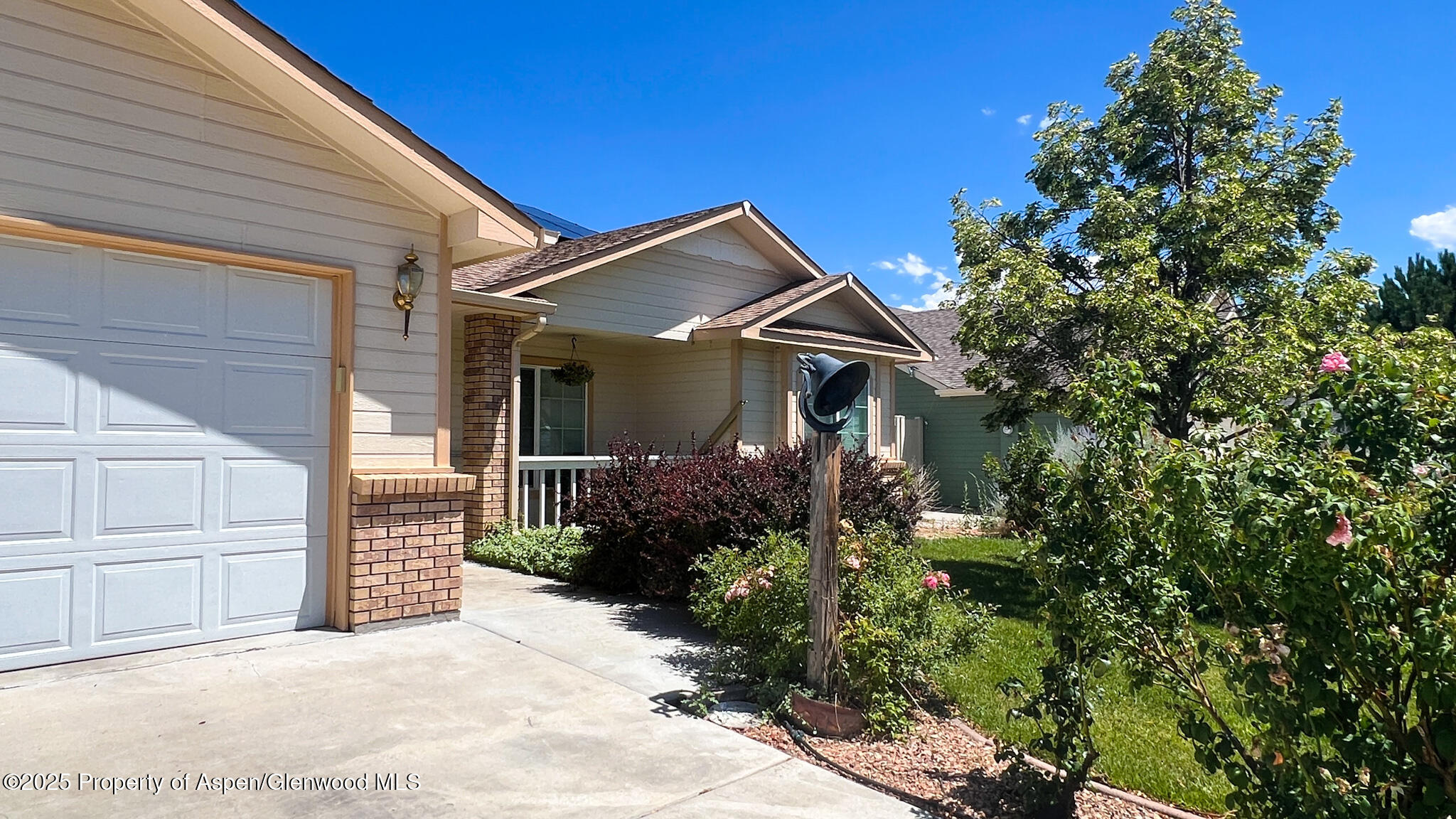 786 Comstock Drive Fruita, CO 81521 - Photo 2 of 38 a front view of a house with a garden