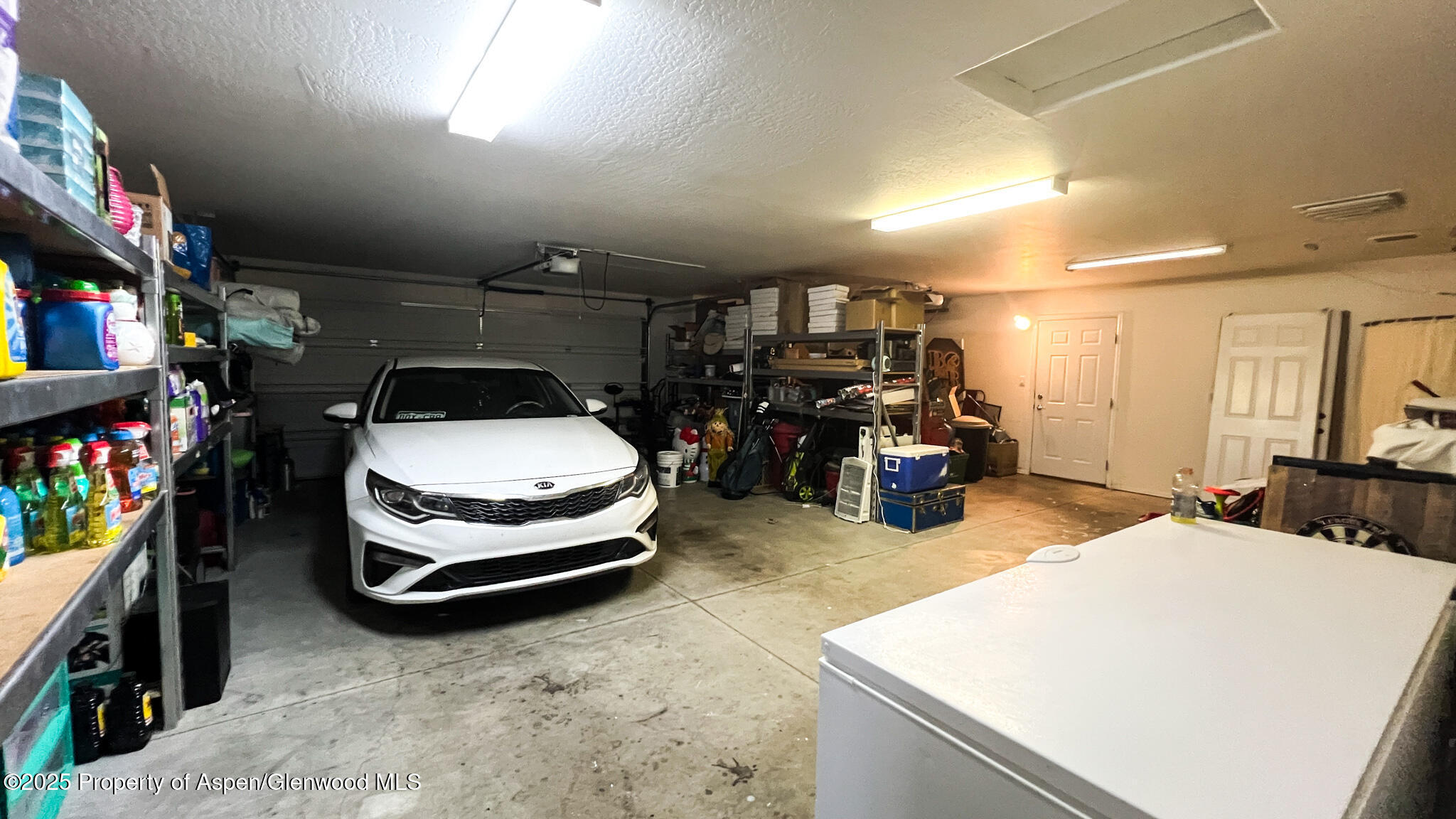 786 Comstock Drive Fruita, CO 81521 - Photo 28 of 38 a car is parked in a garage