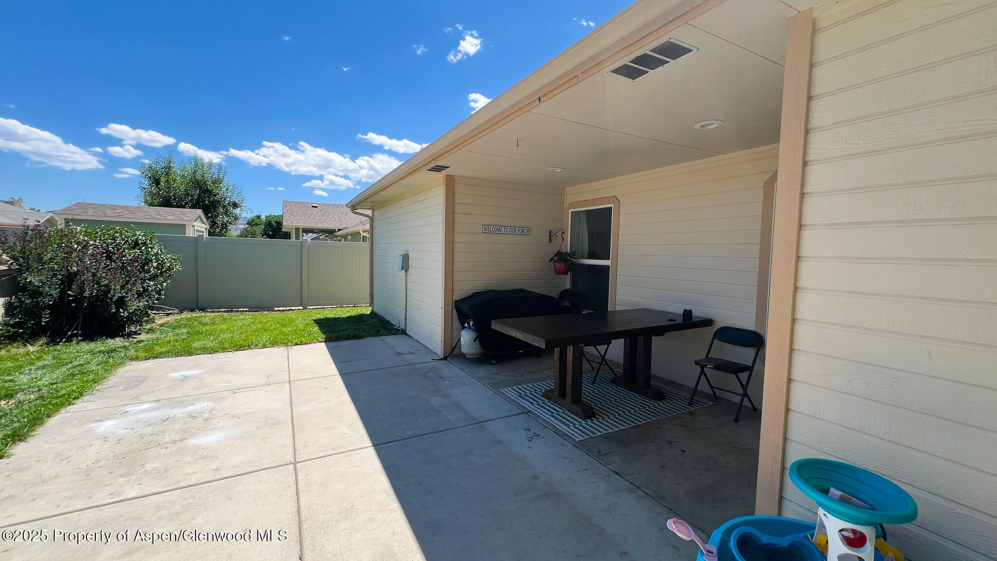 786 Comstock Drive Fruita, CO 81521 - Photo 30 of 38 a view of a porch with furniture and a yard