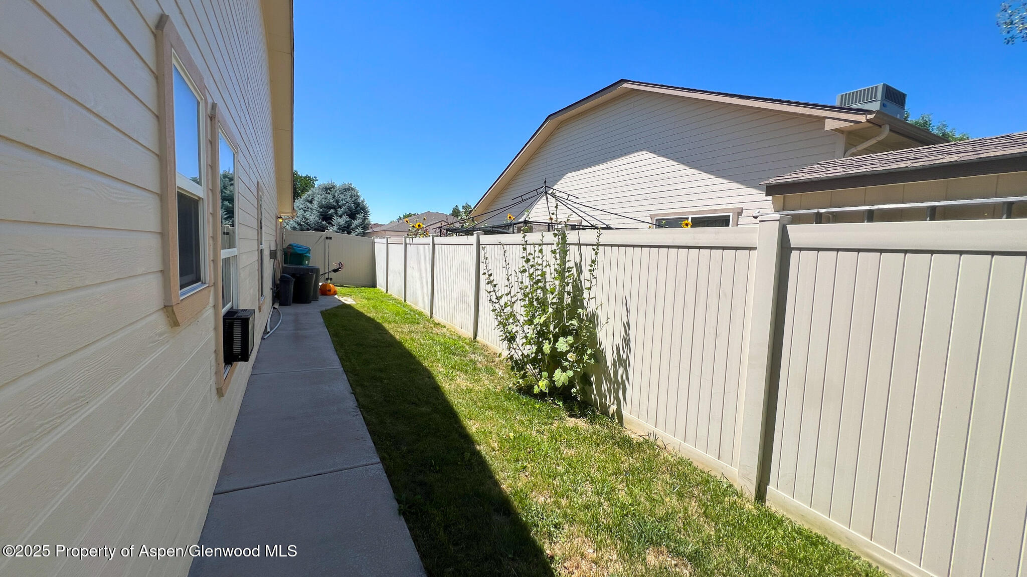 786 Comstock Drive Fruita, CO 81521 - Photo 33 of 38 a view of a house with a small yard