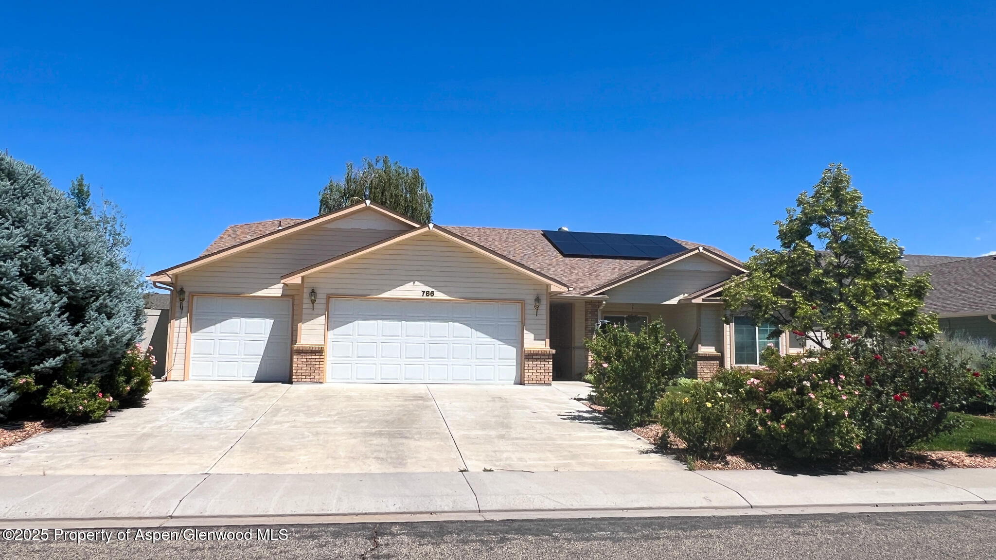 786 Comstock Drive Fruita, CO 81521 - Photo 36 of 38 a view of a house with a yard