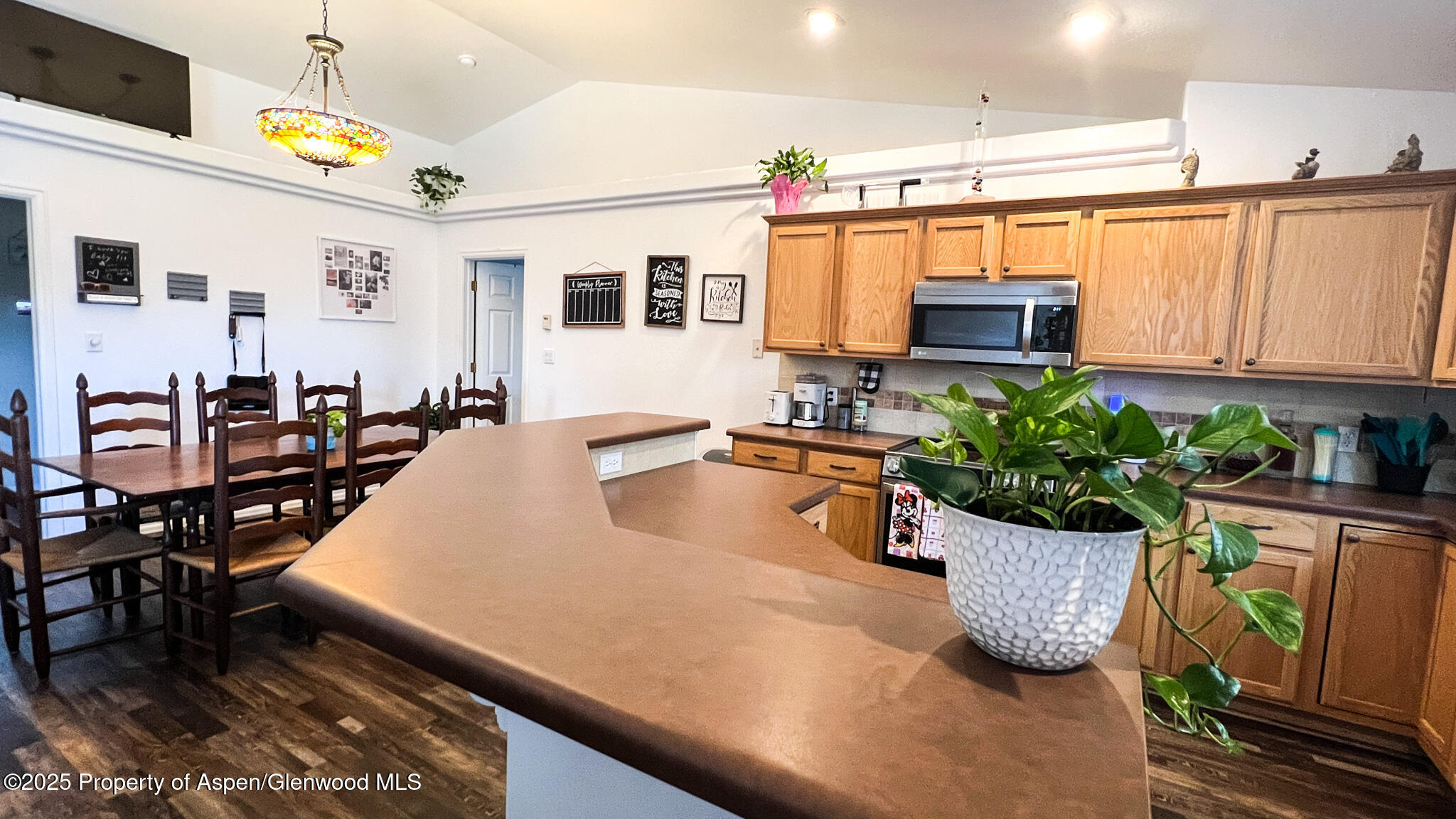 786 Comstock Drive Fruita, CO 81521 - Photo 8 of 38 a kitchen with stainless steel appliances kitchen island granite countertop a sink and cabinets