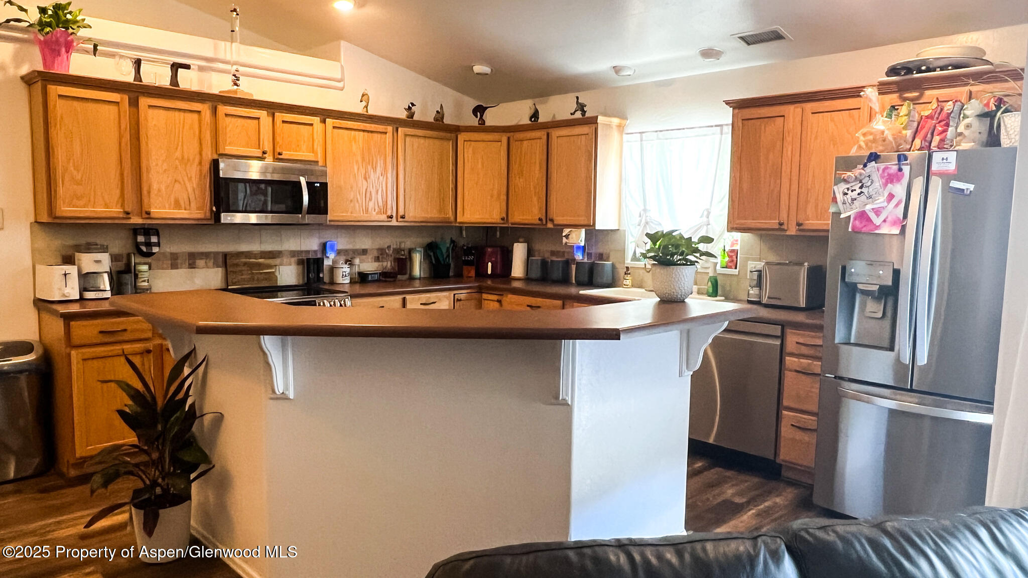 786 Comstock Drive Fruita, CO 81521 - Photo 9 of 38 a kitchen with stainless steel appliances a sink stove and refrigerator