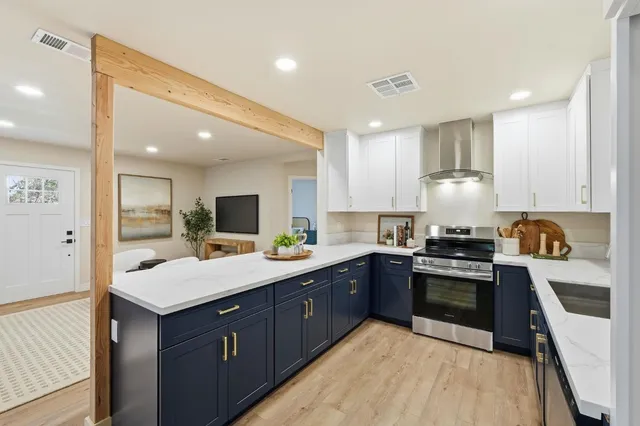 a kitchen with a sink stove and refrigerator