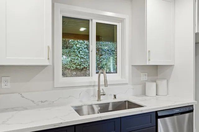 a kitchen with a sink and a window