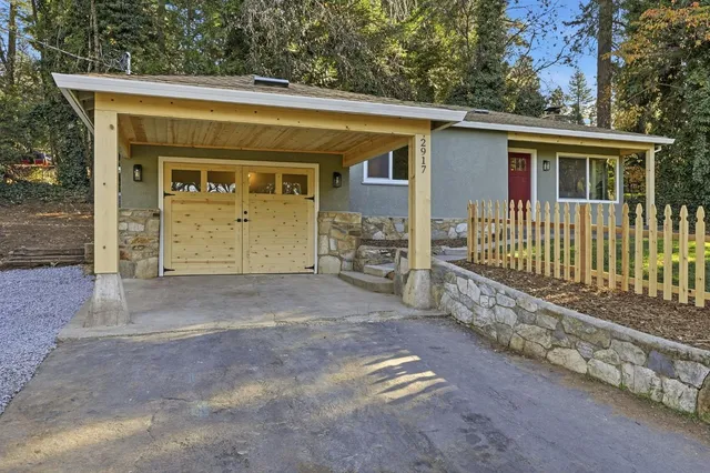 a front view of a house with a garage