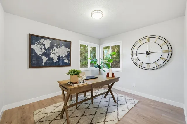 a work room with furniture and a window