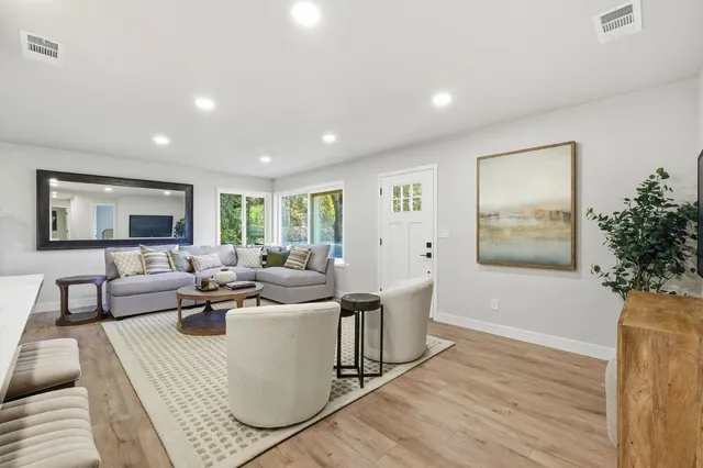 a living room with furniture and a large window