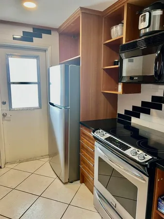 a bathroom with a sink a toilet and a shower