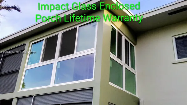 a view of a chairs and table in the patio